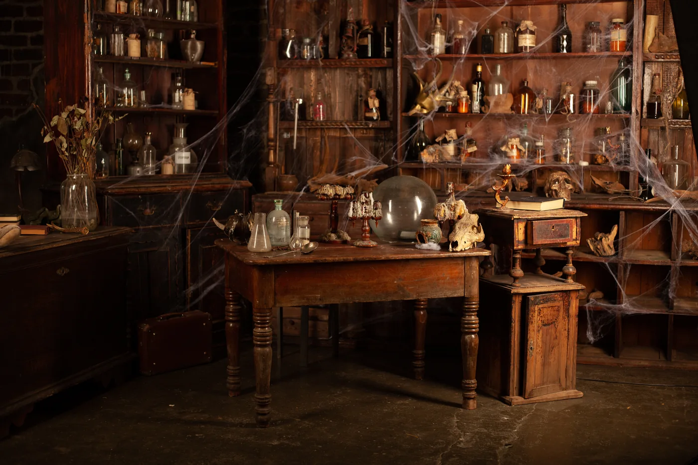 A dusty room lined with wooden shelves and glass bottles